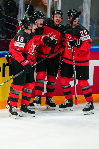 Canada's Samuel Blais, second from left, celebrates with teammates after scoring his side's second goal during the quarterfinal match between Canada and Finland at the ice hockey world championship in Tampere, Finland, Thursday, May 25, 2023. (AP Photo/Pavel Golovkin)