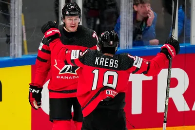 Canada's Samuel Blais, left, celebrates with Peyton Krebs after scoring his side's second goal during the quarterfinal match between Canada and Finland at the ice hockey world championship in Tampere, Finland, Thursday, May 25, 2023. (AP Photo/Pavel Golovkin)
