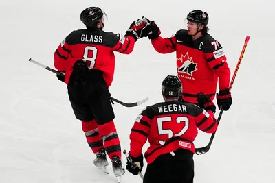 Canada's Tyler Toffoli, right, celebrates with teammates after scoring his side's fourth goal during the quarterfinal match between Canada and Finland at the ice hockey world championship in Tampere, Finland, Thursday, May 25, 2023. (AP Photo/Pavel Golovkin)