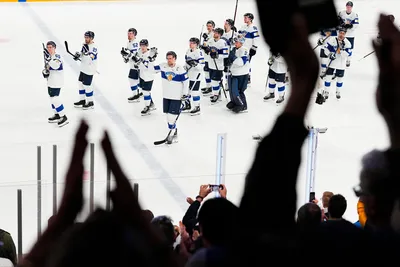 Finland's team players react after the quarterfinal match between Canada and Finland at the ice hockey world championship in Tampere, Finland, Thursday, May 25, 2023. (AP Photo/Pavel Golovkin)