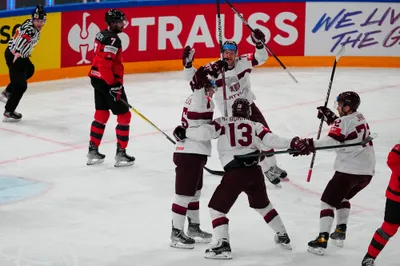 Latvia celebrates a goal during the semifinal match against Canada at the Ice Hockey World Championship in Tampere, Finland, Saturday, May 27, 2023. (AP Photo/Pavel Golovkin)