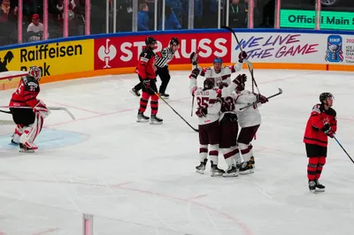 Latvia celebrates a goal during the semifinal match against Canada at the Ice Hockey World Championship in Tampere, Finland, Saturday, May 27, 2023. (AP Photo/Pavel Golovkin)