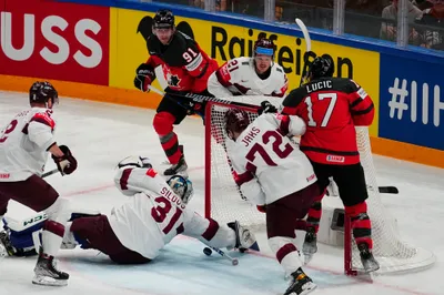 Latvia's goalie Arturs Silovs (31) defends the net during their semifinal match against Canada at the Ice Hockey World Championship in Tampere, Finland, Saturday, May 27, 2023. (AP Photo/Pavel Golovkin)