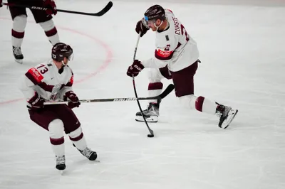 Latvia's Karlis Cukste (2) shoots during their semifinal match against Canada at the Ice Hockey World Championship in Tampere, Finland, Saturday, May 27, 2023. (AP Photo/Pavel Golovkin)