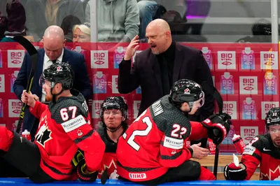 Canada's head coach Andre Tourigny reacts during their semifinal match against Latvia at the Ice Hockey World Championship in Tampere, Finland, Saturday, May 27, 2023. (AP Photo/Pavel Golovkin)