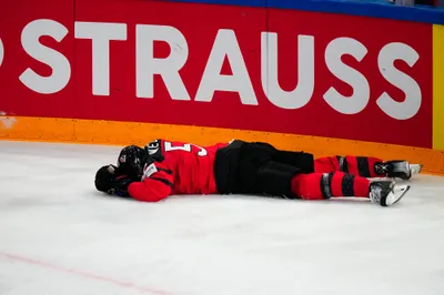 Canada's Jacob Middleton (5) lies on the ice during their semifinal match against Latvia at the Ice Hockey World Championship in Tampere, Finland, Saturday, May 27, 2023. (AP Photo/Pavel Golovkin)