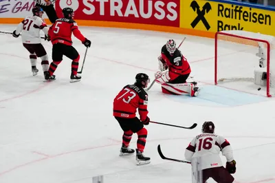 Canada's goalie Samuel Montembeault (35) looks back at the net after Latvia's Rudolfs Balcers (21) scores a goal during their semifinal match at the Ice Hockey World Championship in Tampere, Finland, Saturday, May 27, 2023. (AP Photo/Pavel Golovkin)