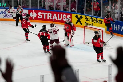 Canada's goalie Samuel Montembeault (35) reacts after Latvia's Rudolfs Balcers (21) scores a goal during their semifinal match at the Ice Hockey World Championship in Tampere, Finland, Saturday, May 27, 2023. (AP Photo/Pavel Golovkin)