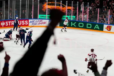 Latvia's Roberts Bukarts (71) celebrates his goal against United States goalie Casey DeSmith (1) in their bronze medal match at the Ice Hockey World Championship in Tampere, Finland, Sunday, May 28, 2023. (AP Photo/Pavel Golovkin)