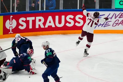 Latvia's Roberts Bukarts (71) celebrates his goal against United States goalie Casey DeSmith (1) in their bronze medal match at the Ice Hockey World Championship in Tampere, Finland, Sunday, May 28, 2023. (AP Photo/Pavel Golovkin)