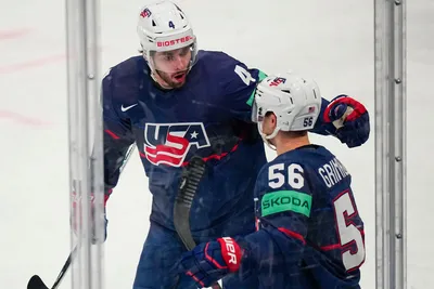 United States Rocco Grimaldi (56) celebrates his goal with Connor Mackey (4) in their bronze medal match against Latvia at the Ice Hockey World Championship in Tampere, Finland, Sunday, May 28, 2023. (AP Photo/Pavel Golovkin)