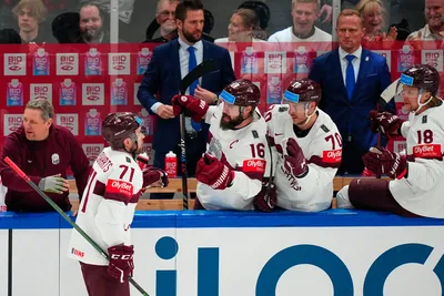 Latvia's Roberts Bukarts (71) celebrates his goal with teammates in their bronze medal match against the United States at the Ice Hockey World Championship in Tampere, Finland, Sunday, May 28, 2023. (AP Photo/Pavel Golovkin)