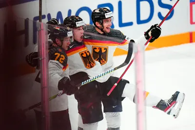 Germany's John Peterka celebrates his goal with teammates during the gold medal match against Canada at the Ice Hockey World Championship in Tampere, Finland, Sunday, May 28, 2023. (AP Photo/Pavel Golovkin)