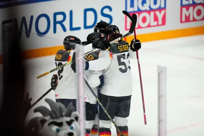Germany's John Peterka celebrates his goal with teammates during the gold medal match against Canada at the Ice Hockey World Championship in Tampere, Finland, Sunday, May 28, 2023. (AP Photo/Pavel Golovkin)