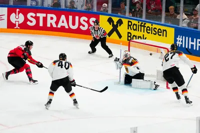 Canada's Samuel Blais (79) scores a goal on Germany's goalie Mathias Niederberger (35) during the gold medal match at the Ice Hockey World Championship in Tampere, Finland, Sunday, May 28, 2023. (AP Photo/Pavel Golovkin)