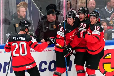 Canada's Samuel Blais (79) celebrates his goal with teammates during the gold medal match against Germany at the Ice Hockey World Championship in Tampere, Finland, Sunday, May 28, 2023. (AP Photo/Pavel Golovkin)