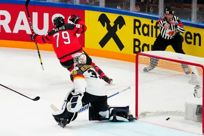 Canada's Samuel Blais (79) celebrates after scoring on Germany's goalie Mathias Niederberger (35) during the gold medal match at the Ice Hockey World Championship in Tampere, Finland, Sunday, May 28, 2023. (AP Photo/Pavel Golovkin)