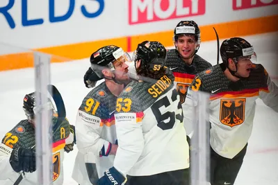 Germany celebrates a goal by John Peterka during the gold medal match against Canada at the Ice Hockey World Championship in Tampere, Finland, Sunday, May 28, 2023. (AP Photo/Pavel Golovkin)