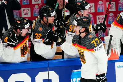 Germany's Daniel Fischbuch (77) celebrates his goal during the gold medal match against Canada at the Ice Hockey World Championship in Tampere, Finland, Sunday, May 28, 2023. (AP Photo/Pavel Golovkin)