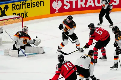 Canada's Lawson Crouse (67) scores a goal on Germany's goalie Mathias Niederberger (35) during the gold medal match at the Ice Hockey World Championship in Tampere, Finland, Sunday, May 28, 2023. (AP Photo/Pavel Golovkin)