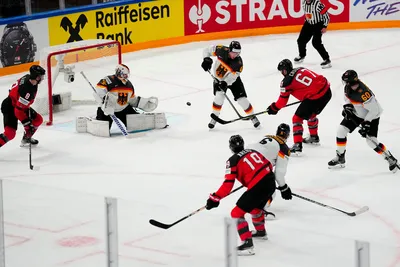 Canada's Lawson Crouse (67) scores on Germany's goalie Mathias Niederberger (35) during the gold medal match at the Ice Hockey World Championship in Tampere, Finland, Sunday, May 28, 2023. (AP Photo/Pavel Golovkin)