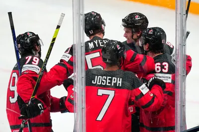 Canada celebrates a goal by Samuel Blais (79) during the gold medal match against Germany at the Ice Hockey World Championship in Tampere, Finland, Sunday, May 28, 2023. (AP Photo/Pavel Golovkin)
