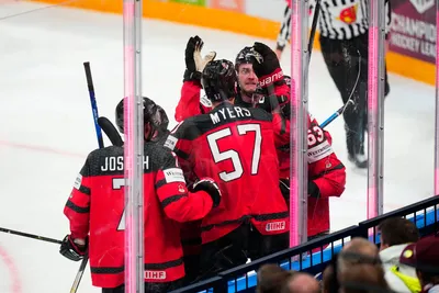Canada celebrates a goal by Samuel Blais during the gold medal match against Germany at the Ice Hockey World Championship in Tampere, Finland, Sunday, May 28, 2023. (AP Photo/Pavel Golovkin)