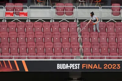 A worker cleans the stands at the Puskas Arena in Budapest, Hungary, Tuesday, May 30, 2023. The Europa League final match between Sevilla FC and AS Roma is held in Budapest on May 31, 2023. (AP Photo/Darko Vojinovic)

- XEUROPALEAGUEX