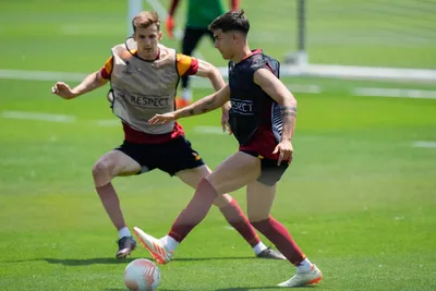 Roma's Paulo Dybala leaves, right, and Roma's Diego Llorente in action during a training session ahead of the Europa League soccer final, at the Trigoria training centre, in Rome, Tuesday, May 30, 2023. Roma will play an Europa League final against Sevilla in Budapest, Hungary, next Wednesday, May 31. (AP Photo/Alessandra Tarantino)

- xeuropaleaguex