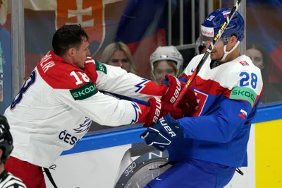 Richard Panik of Slovakia, right, battles with Dominik Kubalik of Czech Republic during the group B match between Slovakia and the Czech Republic at the ice hockey world championship in Riga, Latvia, Friday, May 12, 2023. (AP Photo/Roman Koksarov)