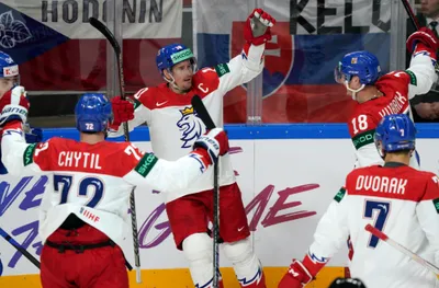 Roman Cervenka of Czech Republic, center, celebrates a goal during the group B match between Slovakia and the Czech Republic at the ice hockey world championship in Riga, Latvia, Friday, May 12, 2023. (AP Photo/Roman Koksarov)