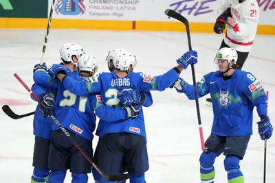 Team Slovenia celebrate a goal during the group B match between Slovenia and Canada at the ice hockey world championship in Riga, Latvia, Sunday, May 14, 2023. (AP Photo/Roman Koksarov)