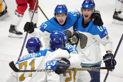 Kazakhstan team players celebrate a goal during the group B match between Czech Republic and Kazakhstan at the ice hockey world championship in Riga, Latvia, Sunday, May 14, 2023. (AP Photo/Roman Koksarov)