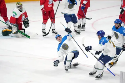 Maxim Mukhametov of Kazakhstan, centre, celebrates a goal during the group B match between Czech Republic and Kazakhstan at the ice hockey world championship in Riga, Latvia, Sunday, May 14, 2023. (AP Photo/Roman Koksarov)