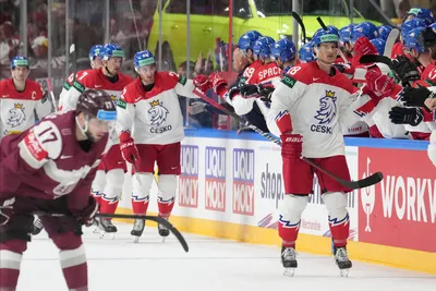 Dominik Kubalik of Czech Republic, right, celebrates a goal during the group B match between Latvia and Czech Republic at the ice hockey world championship in Riga, Latvia, Monday, May 15, 2023. (AP Photo/Roman Koksarov)