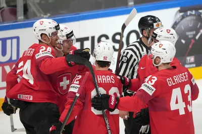Team Switzerland celebrate a goal during the group B match between Switzerland and Kazakhstan at the ice hockey world championship in Riga, Latvia, Tuesday, May 16, 2023. (AP Photo/Roman Koksarov)