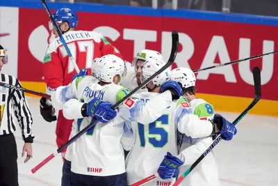 Team Slovenia players celebrate a goal during the group B match between Czech Republic and Slovenia at the ice hockey world championship in Riga, Latvia, Thursday, May 18, 2023. (AP Photo/Roman Koksarov)