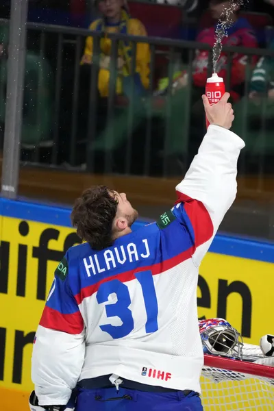 Goalie Samuel Hlavaj of Slovakia splashes water from bottle during the group B match between Slovakia and Kazakhstan at the ice hockey world championship in Riga, Latvia, Friday, May 19, 2023. (AP Photo/Roman Koksarov)