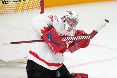 Goalie Joel Hofer of Canada, right, in action during the group B match between Canada and Norway at the ice hockey world championship in Riga, Latvia, Monday, May 22, 2023. (AP Photo/Roman Koksarov)