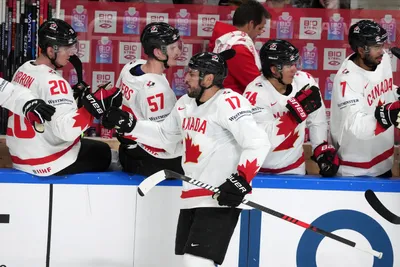 Milan Lucic of Canada, centre, celebrates a goal during the group B match between Canada and Norway at the ice hockey world championship in Riga, Latvia, Monday, May 22, 2023. (AP Photo/Roman Koksarov)