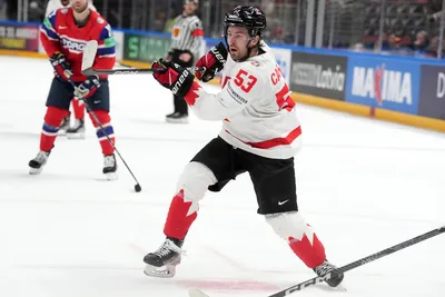 Michael Carcone of Canada in action during the group B match between Canada and Norway at the ice hockey world championship in Riga, Latvia, Monday, May 22, 2023. (AP Photo/Roman Koksarov)