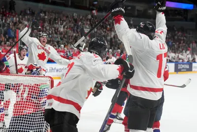 Team Canada players celebrate a goal during the group B match between Canada and Norway at the ice hockey world championship in Riga, Latvia, Monday, May 22, 2023. (AP Photo/Roman Koksarov)