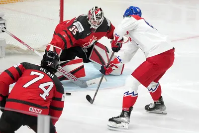 Martin Kaut of Czech Republic scores past the goalie of Samuel Montembeault Canada during the group B match between Canada and Czech Republic at the ice hockey world championship in Riga, Latvia, Tuesday, May 23, 2023. (AP Photo/Roman Koksarov)