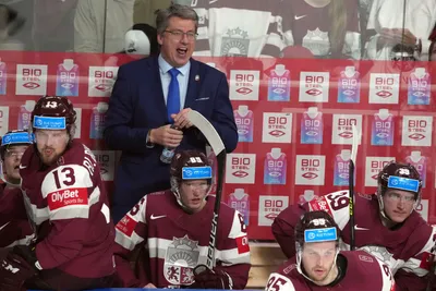 Head coach Harijs Vitolins of Latvia reacts during the quarter final match between Latvia and Sweden at the ice hockey world championship in Riga, Latvia, Thursday, May 25, 2023. (AP Photo/Roman Koksarov)