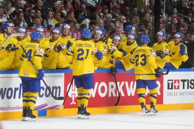 Team Sweden players celebrate a goal during the quarter final match between Latvia and Sweden at the ice hockey world championship in Riga, Latvia, Thursday, May 25, 2023. (AP Photo/Roman Koksarov)