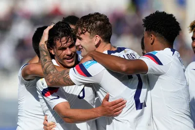 Cade Cowell of the United States, left, celebrates with his teammates after scoring his side's first goal during a FIFA U-20 World Cup Group B soccer match against Slovakia at the San Juan stadium in San Juan, Argentina, Friday, May 26, 2023. (AP Photo/Natacha Pisarenko)