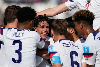 Cade Cowell of the United States, center, celebrates with his teammates after scoring his side's first goal during a FIFA U-20 World Cup Group B soccer match against Slovakia at the San Juan stadium in San Juan, Argentina, Friday, May 26, 2023. (AP Photo/Natacha Pisarenko)