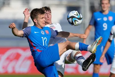 Slovakia's Dominik Snajder, front, and Daniel Edelman of the United States battle for the ball during a FIFA U-20 World Cup Group B soccer match at the San Juan stadium in San Juan, Argentina, Friday, May 26, 2023. (AP Photo/Natacha Pisarenko)