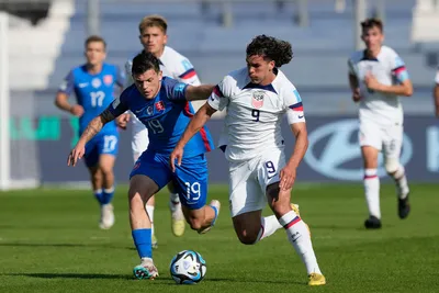 Cade Cowell of the United States, right, and Slovakia's Samuel Kopasek battle for the ball during a FIFA U-20 World Cup Group B soccer match at the San Juan stadium in San Juan, Argentina, Friday, May 26, 2023. (AP Photo/Natacha Pisarenko)