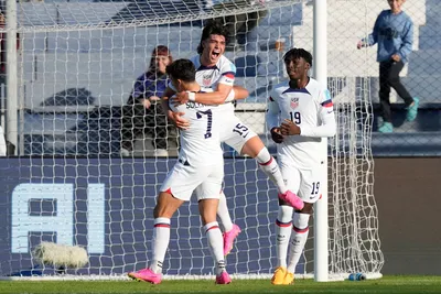 Niko Tsakiris of the United States, center, celebrates with his teammates after scoring his side's second goal during a FIFA U-20 World Cup Group B soccer match against Slovakia at the San Juan stadium in San Juan, Argentina, Friday, May 26, 2023. (AP Photo/Natacha Pisarenko)